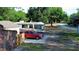 Exterior view of home with RV, red car, and a shed at 15308 Fruitville Rd, Sarasota, FL 34240