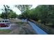 Aerial view of property featuring an RV, car, outbuildings, and driveway with a fence at 15308 Fruitville Rd, Sarasota, FL 34240