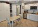 This small kitchen features stainless steel appliances and bright white cabinets at 15308 Fruitville Rd, Sarasota, FL 34240