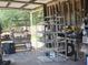 Workshop and storage area with shelving units and various tools at 15308 Fruitville Rd, Sarasota, FL 34240