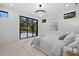 Main bedroom with access to the backyard pool featuring large glass doors and recessed lighting at 1559 Bay Rd, Sarasota, FL 34239