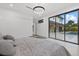 Main bedroom with large glass doors that lead to a patio with pool at 1559 Bay Rd, Sarasota, FL 34239