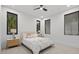Comfortable bedroom with neutral tones, soft carpet, and modern black windows for a relaxing retreat at 1559 Bay Rd, Sarasota, FL 34239