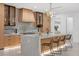 Well-lit kitchen with stainless steel appliances, custom cabinetry, and stylish lighting at 1559 Bay Rd, Sarasota, FL 34239
