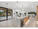 Spacious open kitchen with a large island, wine cooler, and backyard view at 1559 Bay Rd, Sarasota, FL 34239