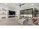 Modern living room featuring recessed lighting, built-in shelves, and comfortable seating at 1559 Bay Rd, Sarasota, FL 34239