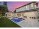 Stylish pool area featuring a spa, pristine patio, and tasteful landscaping around the modern home at 1559 Bay Rd, Sarasota, FL 34239