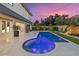 Luxurious pool and spa with elegant patio design, surrounded by lush landscaping and modern architecture at 1559 Bay Rd, Sarasota, FL 34239