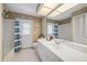 Bathroom with white countertops, and a bathtub at 1661 Cottonwood Trl, Sarasota, FL 34232