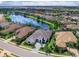 Aerial view of stunning lakefront property in a residential neighborhood at 16614 Berwick Ter, Lakewood Ranch, FL 34202