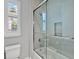 Modern bathroom features a glass shower enclosure with a tiled surround and a shower niche at 16614 Berwick Ter, Lakewood Ranch, FL 34202
