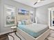 Inviting bedroom with plush bed, stylish decor, and ample natural light from the windows at 16614 Berwick Ter, Lakewood Ranch, FL 34202