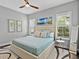 Comfortable bedroom featuring a soft bed, ceiling fan, and serene decor, perfect for relaxation at 16614 Berwick Ter, Lakewood Ranch, FL 34202
