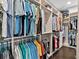 Well-organized walk-in closet provides ample storage with custom shelving and hanging rods at 16614 Berwick Ter, Lakewood Ranch, FL 34202