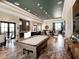 Spacious clubhouse interior featuring a pool table, bar area, and comfortable seating for residents at 16614 Berwick Ter, Lakewood Ranch, FL 34202