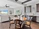 The dining area features a round table with seating for four and elegant decor elements at 16614 Berwick Ter, Lakewood Ranch, FL 34202