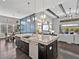 Gorgeous kitchen island with seating and stainless appliances, open to living and dining areas at 16614 Berwick Ter, Lakewood Ranch, FL 34202