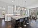 Gourmet kitchen featuring a large island, granite countertops, stainless steel appliances, and pendant lighting at 16614 Berwick Ter, Lakewood Ranch, FL 34202