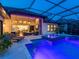 Relaxing pool area with integrated spa, covered lanai, and stylish outdoor furniture for entertaining and leisure at 16614 Berwick Ter, Lakewood Ranch, FL 34202