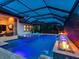 Enclosed pool with a spa, water features, fire bowls, and steps into the pool at 16614 Berwick Ter, Lakewood Ranch, FL 34202
