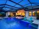 Inviting outdoor pool and spa area featuring a screened enclosure and comfortable seating, perfect for relaxation at 16614 Berwick Ter, Lakewood Ranch, FL 34202