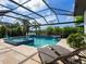 Beautiful backyard oasis featuring a sparkling pool, spa, and lush landscaping for ultimate privacy at 16614 Berwick Ter, Lakewood Ranch, FL 34202