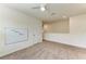 Upstairs neutral bedroom features bright walls and neutral carpeting at 17124 Harvest Moon Way, Lakewood Ranch, FL 34211