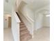 Hallway and staircase featuring neutral walls, carpeting, and tile flooring at 17124 Harvest Moon Way, Lakewood Ranch, FL 34211