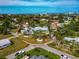 Aerial view of the house surrounded by a circular driveway, mature trees, and lush landscaping at 1722 Hazelwood St, Sarasota, FL 34231