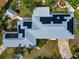 A high aerial view of a property with solar panels, landscaping and a shed at 1722 Hazelwood St, Sarasota, FL 34231