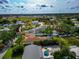 A view of a cozy home with new solar panels, complemented by a beautiful green yard at 1722 Hazelwood St, Sarasota, FL 34231