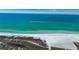 Breathtaking beach day featuring sugar sand and emerald coast with boat speeding along at 1722 Hazelwood St, Sarasota, FL 34231