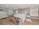 Beautifully decorated bedroom with a king-sized bed, a wooden accent wall, and lots of natural light at 1722 Hazelwood St, Sarasota, FL 34231