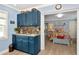 Bedroom with light blue walls viewed through an attached kitchenette at 1722 Hazelwood St, Sarasota, FL 34231