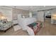 Cozy bedroom featuring a king bed with bright bedding, stylish accents, and natural light at 1722 Hazelwood St, Sarasota, FL 34231
