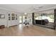 Bright dining area with table, stylish china cabinet, and seamless access to an outdoor patio at 1722 Hazelwood St, Sarasota, FL 34231