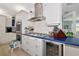 Well-equipped kitchen with stainless steel appliances, a gas cooktop, and built-in wine cooler at 1722 Hazelwood St, Sarasota, FL 34231