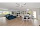 Spacious living room with light gray walls and seamless transitions between dining area and cozy living space at 1722 Hazelwood St, Sarasota, FL 34231