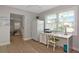 Home office area features a functional desk space, ample natural light, and convenient refrigerator at 1722 Hazelwood St, Sarasota, FL 34231