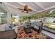 Outdoor patio with stylish seating, a colorful rug, and a charming view of the backyard at 1722 Hazelwood St, Sarasota, FL 34231
