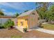 Well-maintained shed with decorative trim, flower boxes, and a clean exterior at 1722 Hazelwood St, Sarasota, FL 34231