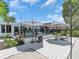 Spacious backyard with a grill, patio, lounge seating and manicured gravel at 2235 Arlington St, Sarasota, FL 34239