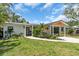 Charming single story home featuring a well-manicured lawn and updated exterior at 2235 Arlington St, Sarasota, FL 34239
