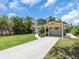 Updated home featuring a long driveway and carport at 2235 Arlington St, Sarasota, FL 34239