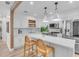 Modern kitchen with white cabinets, stone countertops, and stainless steel appliances at 2235 Arlington St, Sarasota, FL 34239