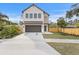 Stunning two-story home showcasing modern architecture and a well-manicured front yard at 2249 Oak Terrace St, Sarasota, FL 34231