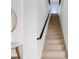 Bright, modern staircase with light wood steps and black handrail, leading to an upper level with natural light at 2249 Oak Terrace St, Sarasota, FL 34231