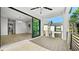 Spacious balcony with railing, tile floor, ceiling fan, and sliding glass doors with view of backyard at 2249 Oak Terrace Ter, Sarasota, FL 34231