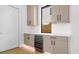 Bar area with modern cabinets, countertop, a wine cooler, and a window view at 2249 Oak Terrace Ter, Sarasota, FL 34231