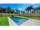 Backyard swimming pool and lush landscaping at 2249 Oak Terrace Ter, Sarasota, FL 34231